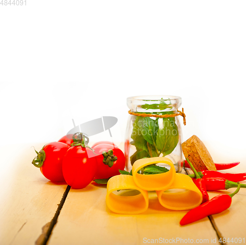 Image of Italian pasta paccheri with tomato mint and chili pepper