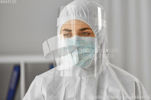 Image of doctor in protective wear, mask and face shield