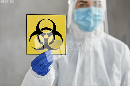 Image of doctor in protective wear, mask and face shield