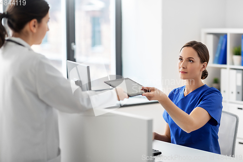 Image of doctor and nurse with tablet computer at hospital