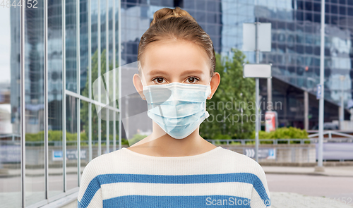 Image of teenage girl in medical mask over city street