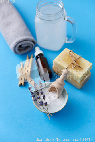 Image of washing soda, soap, towel, dropper and clothespins