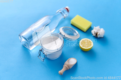 Image of lemon, washing soda, vinegar, sponge and cotton