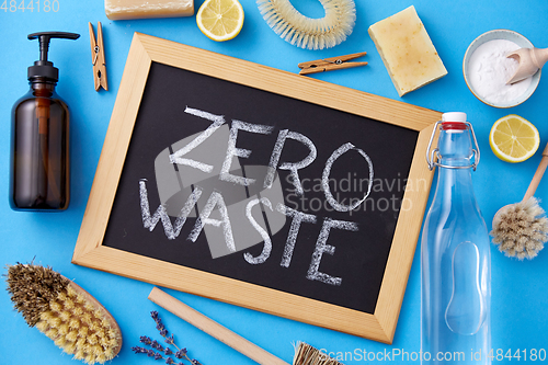 Image of zero waste words on chalkboard and cleaning stuff