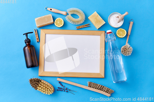 Image of natural cleaning supplies around white board