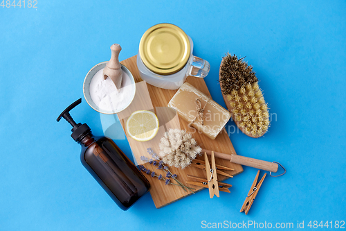 Image of washing soda, soap, brushes, lemon and clothespins