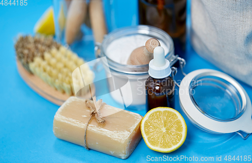 Image of lemons, soap, washing soda, vinegar and brushes