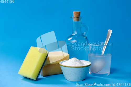 Image of washing soda, sponge, soap, vinegar and glass