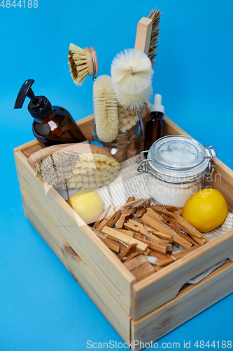 Image of box with clothespins and natural cleaning supplies