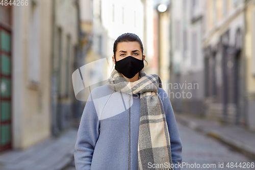 Image of woman wearing protective reusable barrier mask