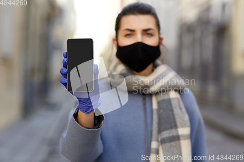 Image of woman wearing protective reusable barrier mask