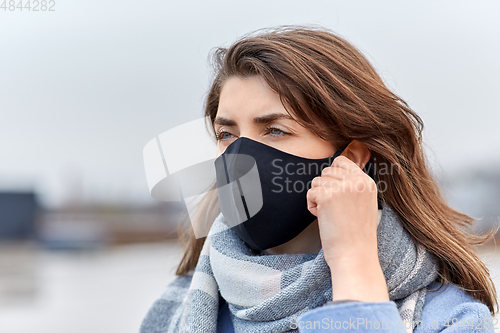 Image of woman wearing protective reusable barrier mask