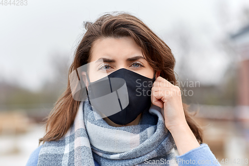 Image of woman wearing protective reusable barrier mask