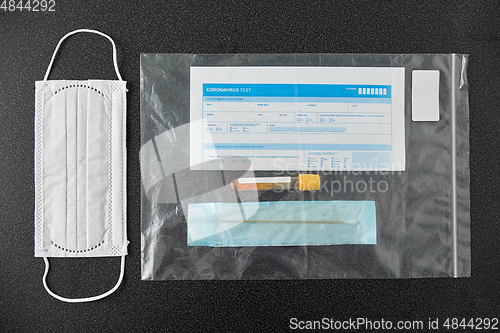 Image of test tube, medical report, cotton swab and mask