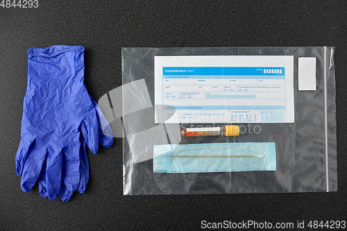 Image of test tube, cotton swab, medical report and gloves