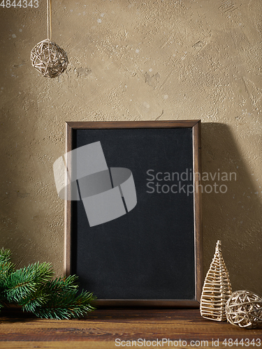 Image of Christmas composition with blackboard