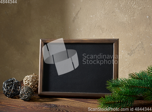 Image of Christmas composition with blackboard