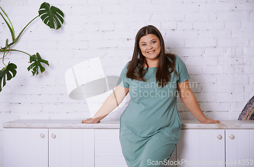 Image of Plus size model at home