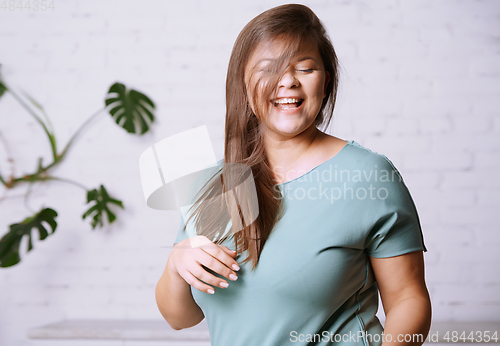 Image of Portrait of the happy plus size model