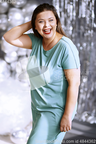 Image of Portrait of the playful plus size model