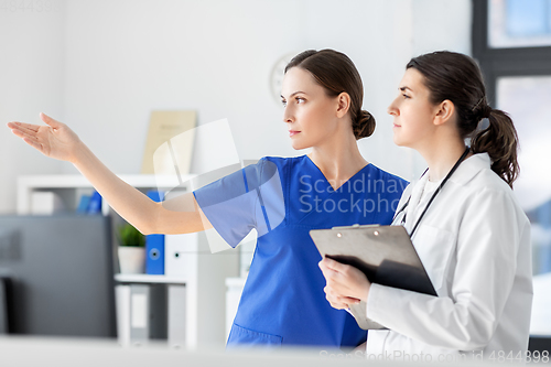 Image of nurse showing something to doctor at hospital
