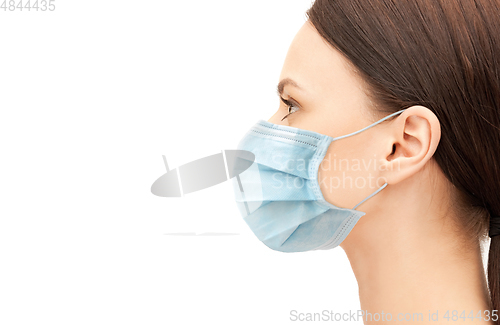 Image of profile of young woman wearing medical mask