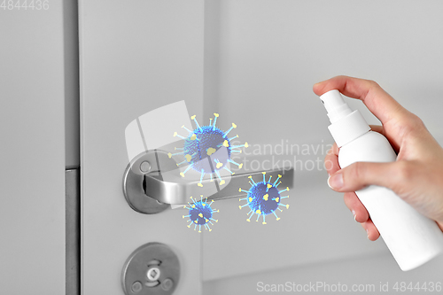 Image of sanitizer spray kills coronavirus on door handle