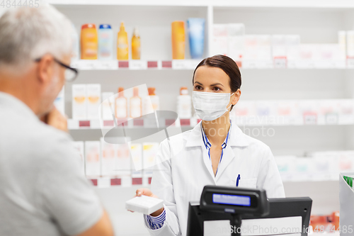 Image of apothecary in mask showing drug to man at pharmacy