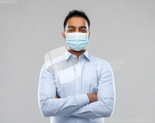 Image of indian businessman in mask over grey background