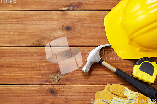 Image of different work tools on wooden boards