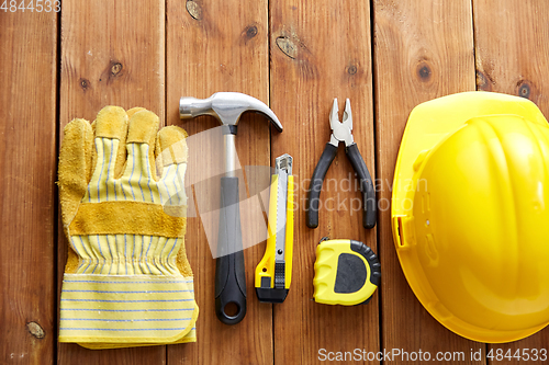 Image of different work tools on wooden boards