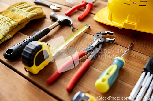 Image of different work tools on wooden boards