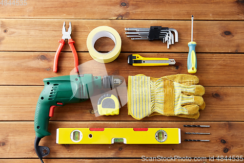 Image of different work tools on wooden boards