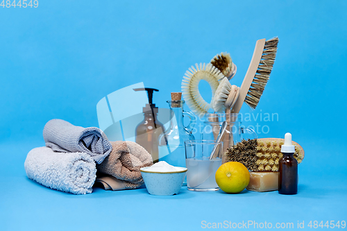 Image of lemons, soap, washing soda, vinegar and brushes