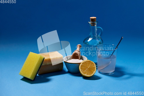 Image of washing soda, lemon, sponge, soap and vinegar