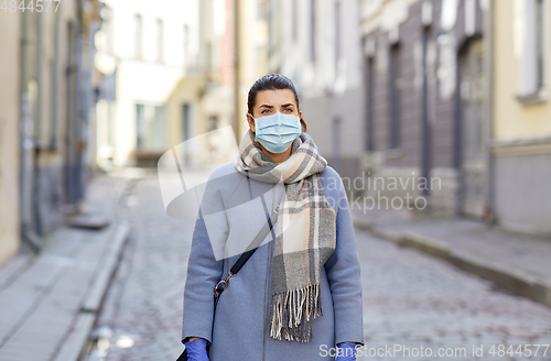 Image of young woman wearing protective medical mask