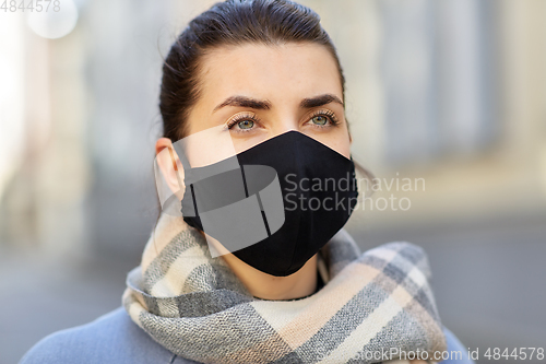 Image of woman wearing protective reusable barrier mask