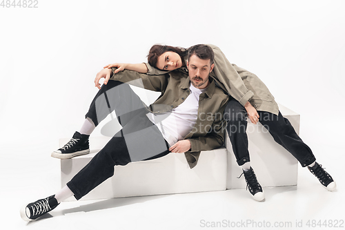 Image of Trendy fashionable couple isolated on white studio background