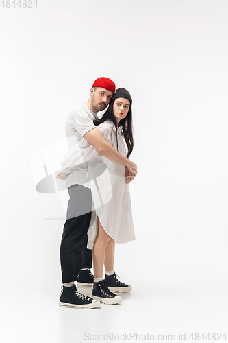 Image of Trendy fashionable couple isolated on white studio background