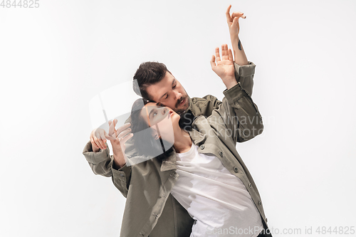 Image of Trendy fashionable couple isolated on white studio background