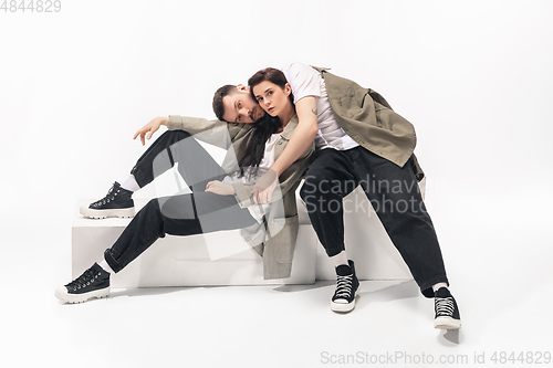 Image of Trendy fashionable couple isolated on white studio background