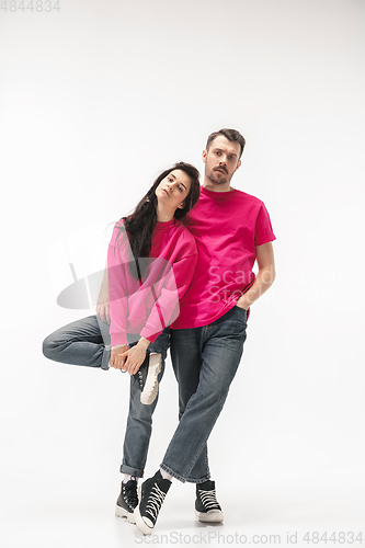 Image of Trendy fashionable couple isolated on white studio background