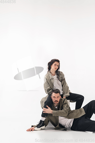 Image of Trendy fashionable couple isolated on white studio background