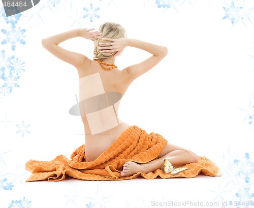 Image of beautiful lady with orange towels