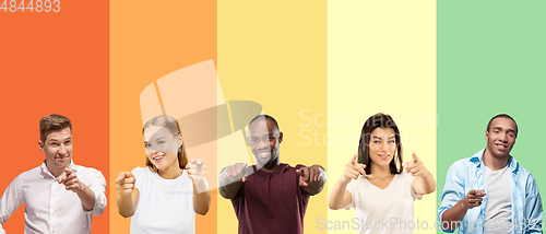 Image of Portrait of group of emotional people on multicolored background