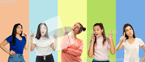 Image of Portrait of group of emotional people on multicolored background