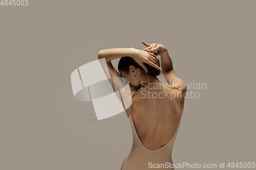 Image of Young graceful tender ballerina on pastel studio background