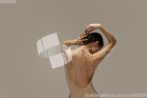 Image of Young graceful tender ballerina on pastel studio background