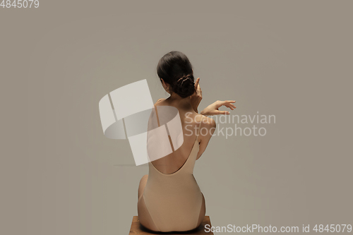 Image of Young graceful tender ballerina on pastel studio background
