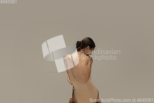 Image of Young graceful tender ballerina on pastel studio background